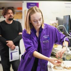 student using lab equipment