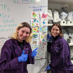 two tutors smiling