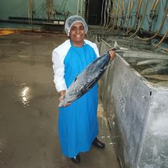 Soni holding a large tuna fish.