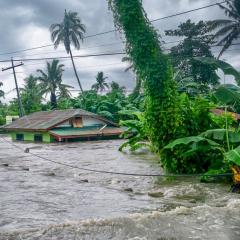 A house is inundated by flood waters
